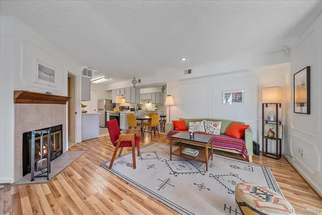 a living room with lots of furniture and flat screen tv