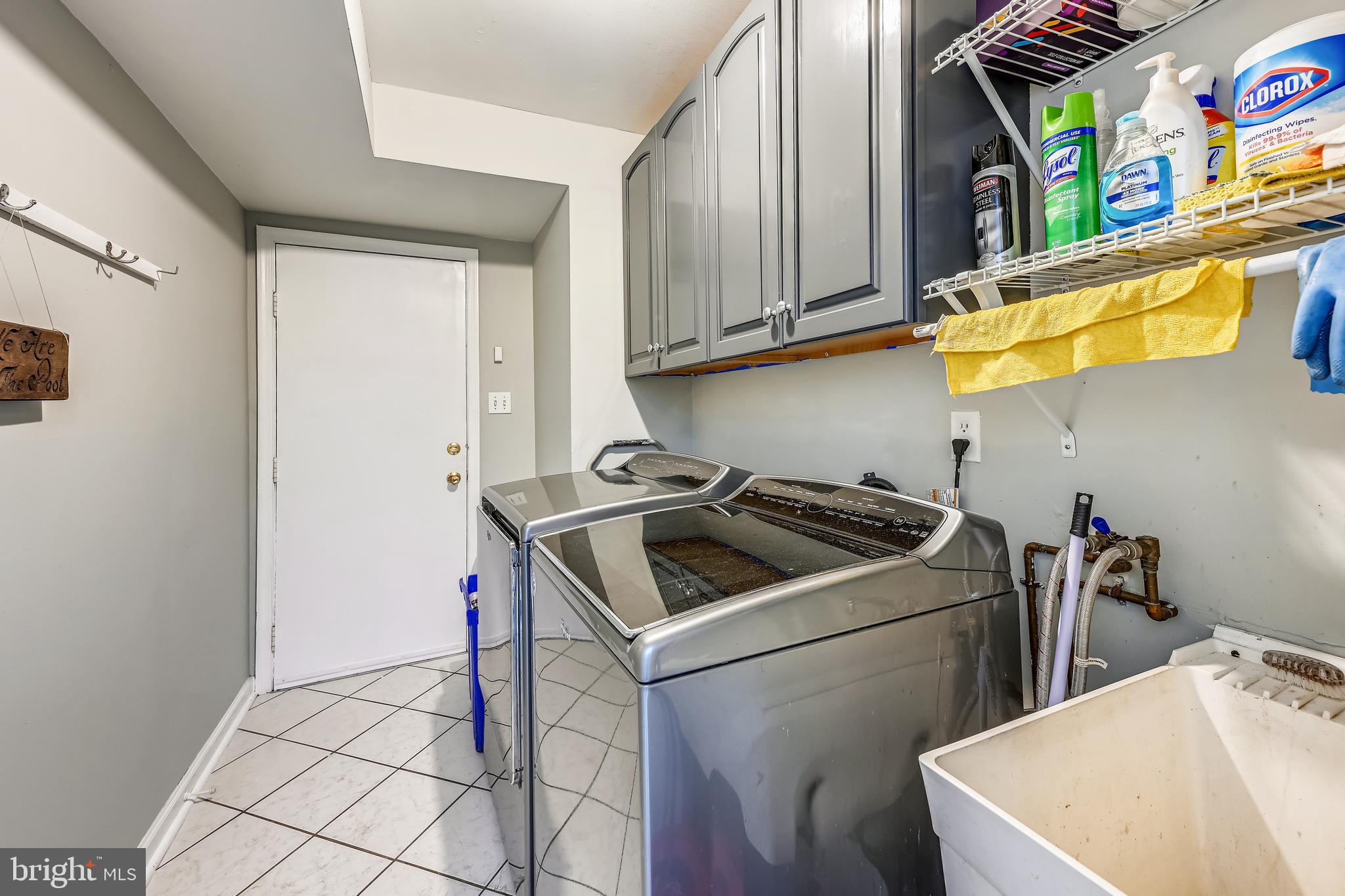 2116 Kings House Road Silver Spring, MD 20905 - Photo 22 of 37 a kitchen with stainless steel appliances granite countertop a sink and a refrigerator