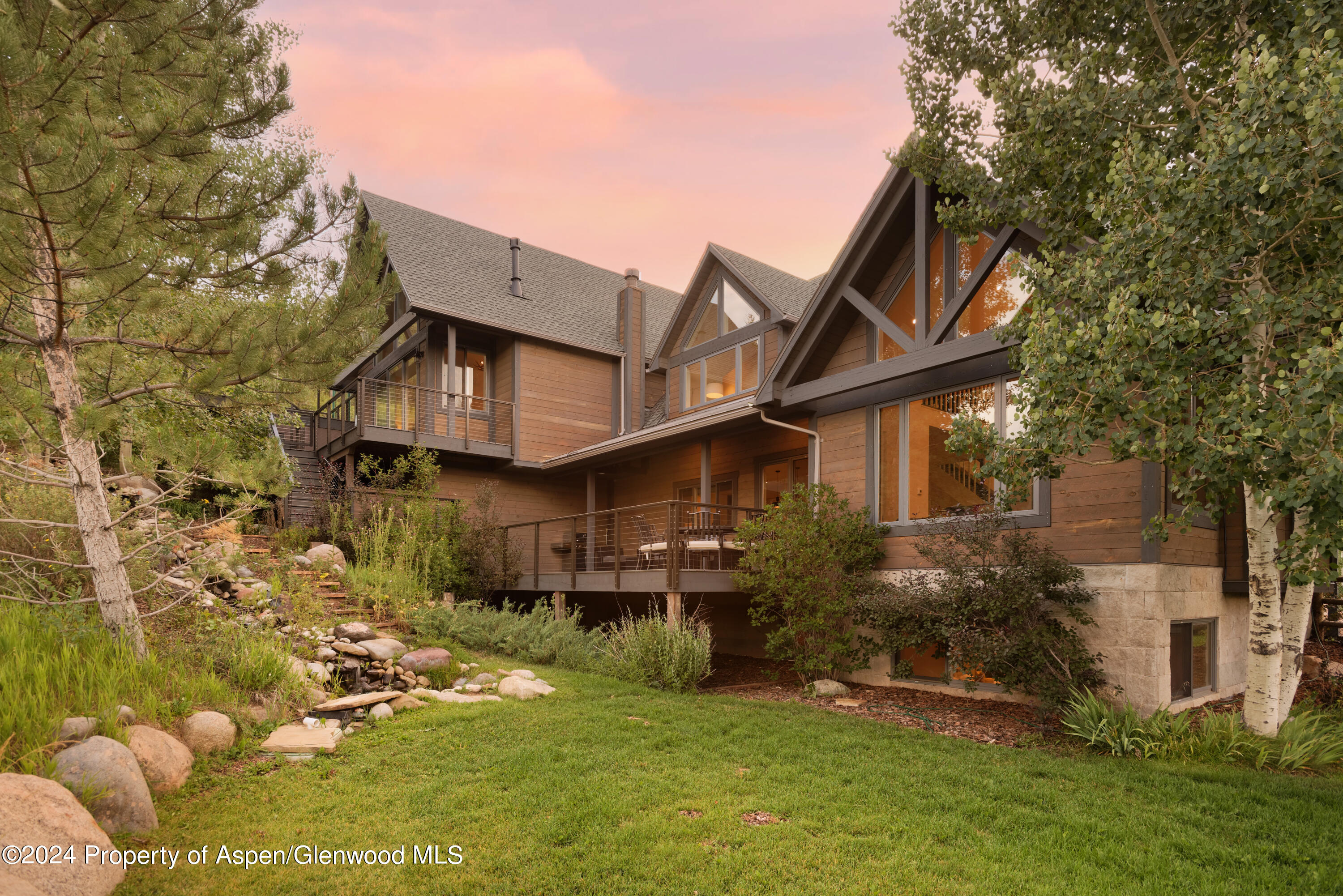 400 Medicine Bow Road Aspen, CO 81611 - Photo 28 of 36 a front view of a house with a yard