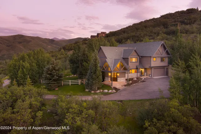 a view of a town with mountains in the background