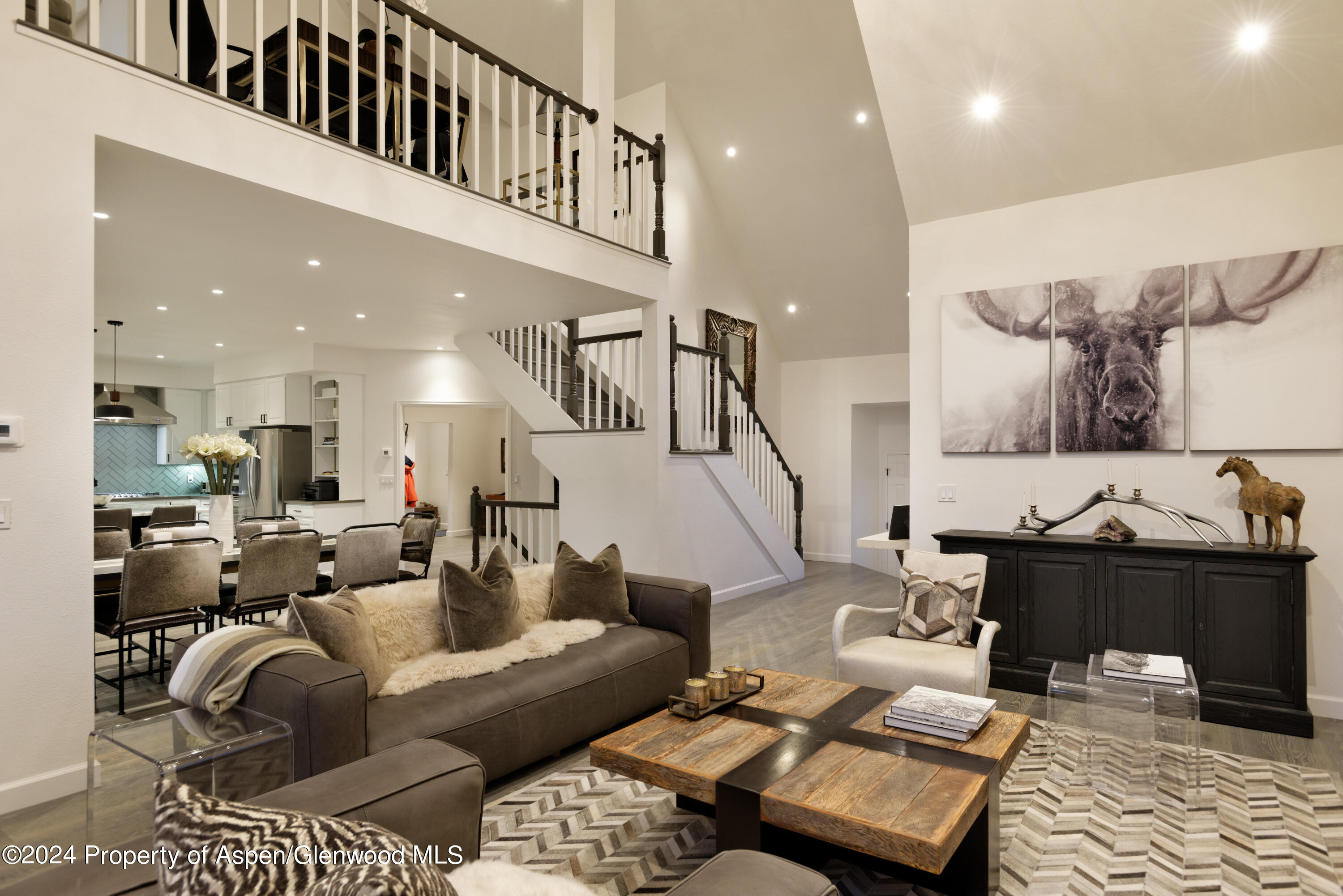400 Medicine Bow Road Aspen, CO 81611 - Photo 3 of 36 a living room with furniture or couch and a table