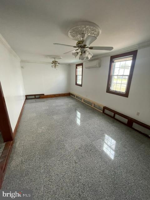 10 Middle Road Levittown, PA 19056 - Photo 19 of 25 en empty room with windows and ceiling fan