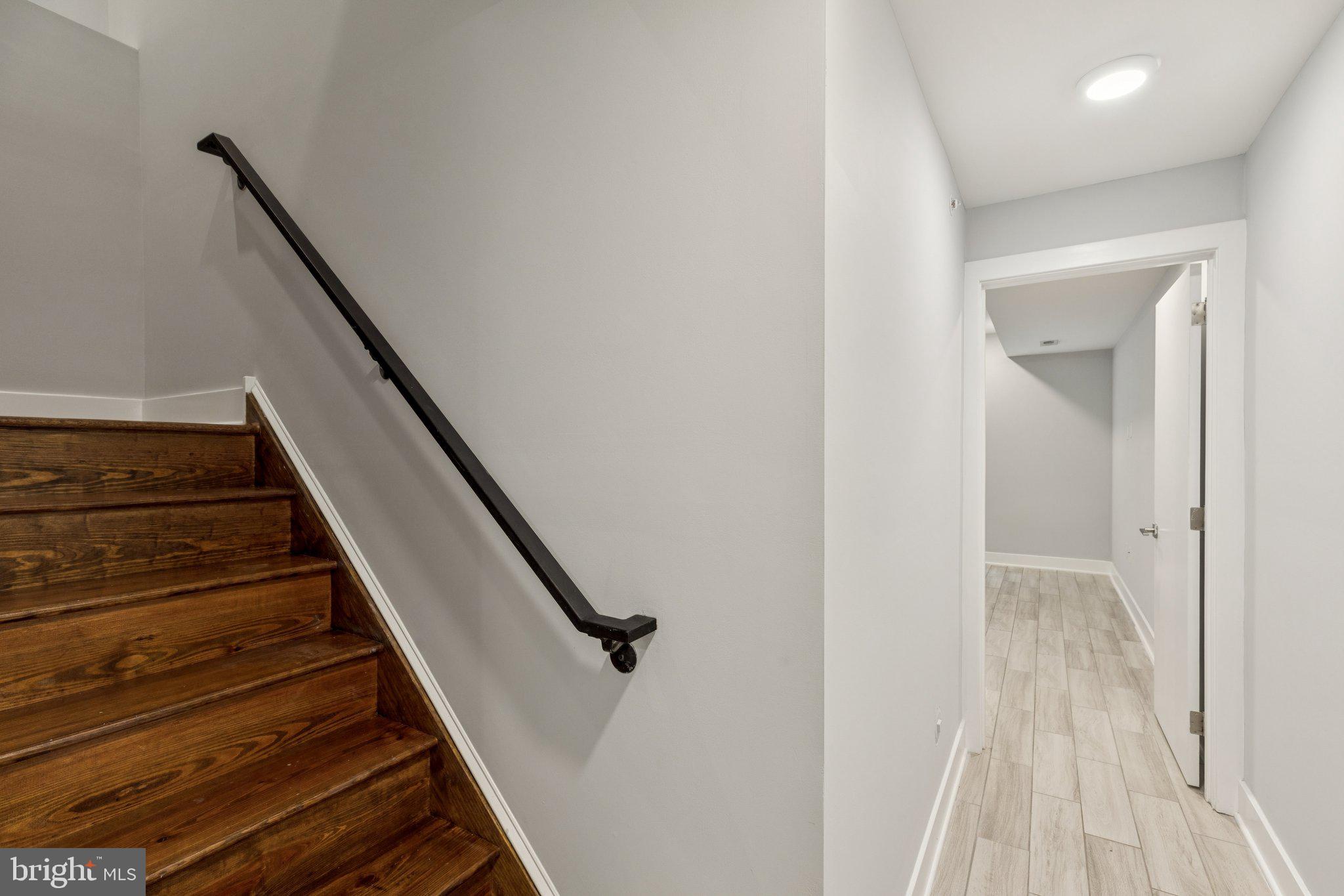 814 North Uber Street, Unit 2 Philadelphia, PA 19130 - Photo 20 of 68 a view of a hallway with wooden floor and staircase