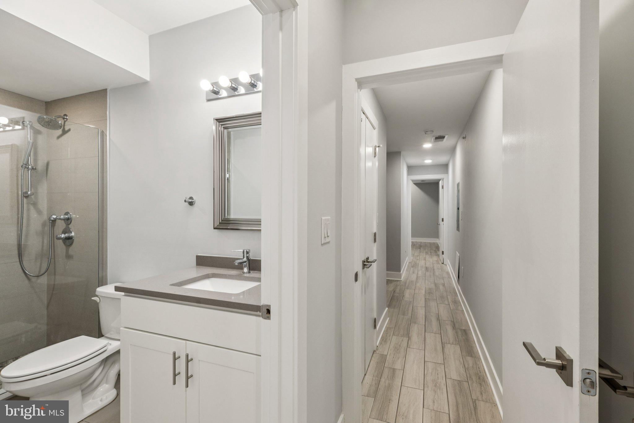 814 North Uber Street, Unit 2 Philadelphia, PA 19130 - Photo 25 of 68 a bathroom with a granite countertop sink toilet and shower