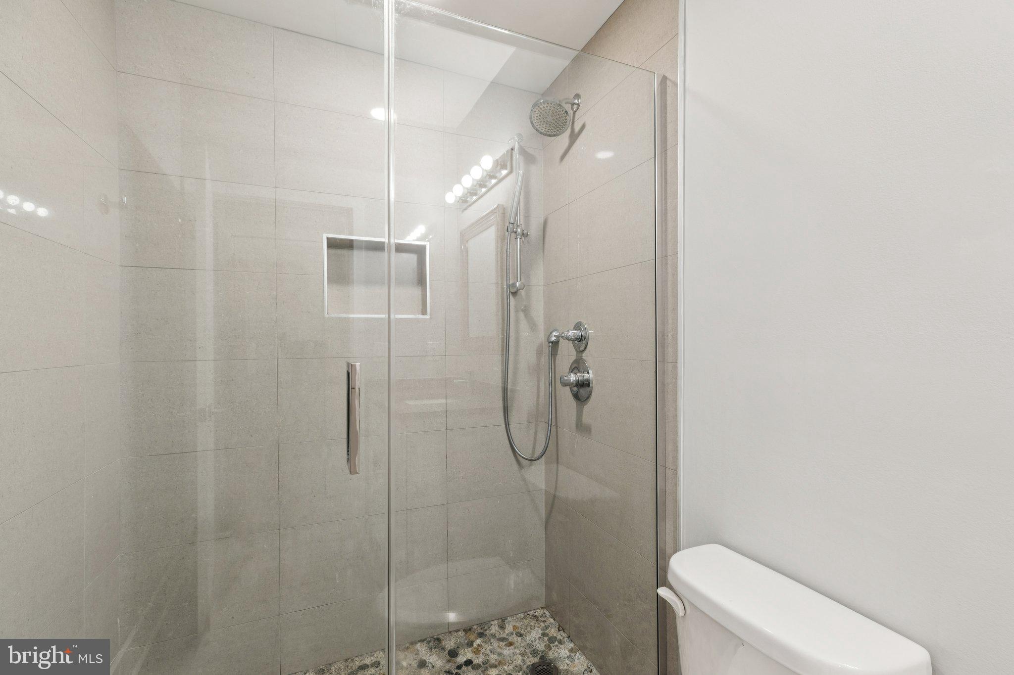 814 North Uber Street, Unit 2 Philadelphia, PA 19130 - Photo 30 of 68 a bathroom with a shower a toilet and sink