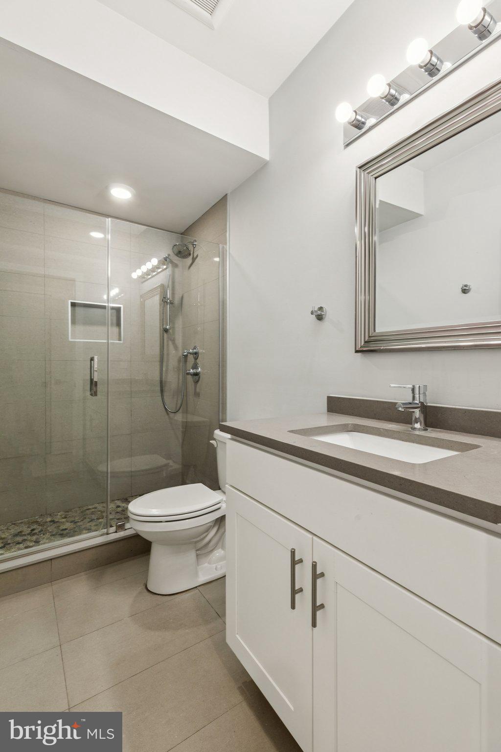 814 North Uber Street, Unit 2 Philadelphia, PA 19130 - Photo 32 of 68 a bathroom with a sink a toilet and shower