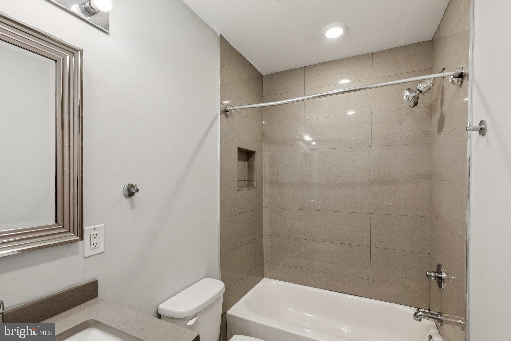 814 North Uber Street, Unit 2 Philadelphia, PA 19130 - Photo 52 of 68 a bathroom with a shower a toilet and a sink