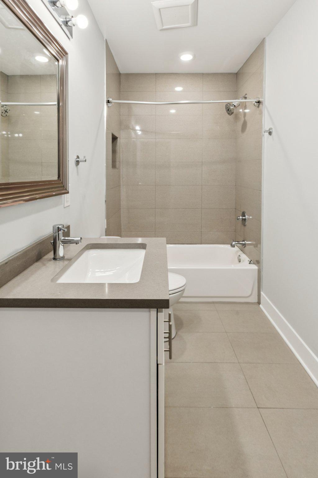 814 North Uber Street, Unit 2 Philadelphia, PA 19130 - Photo 53 of 68 a bathroom with a sink a toilet and shower