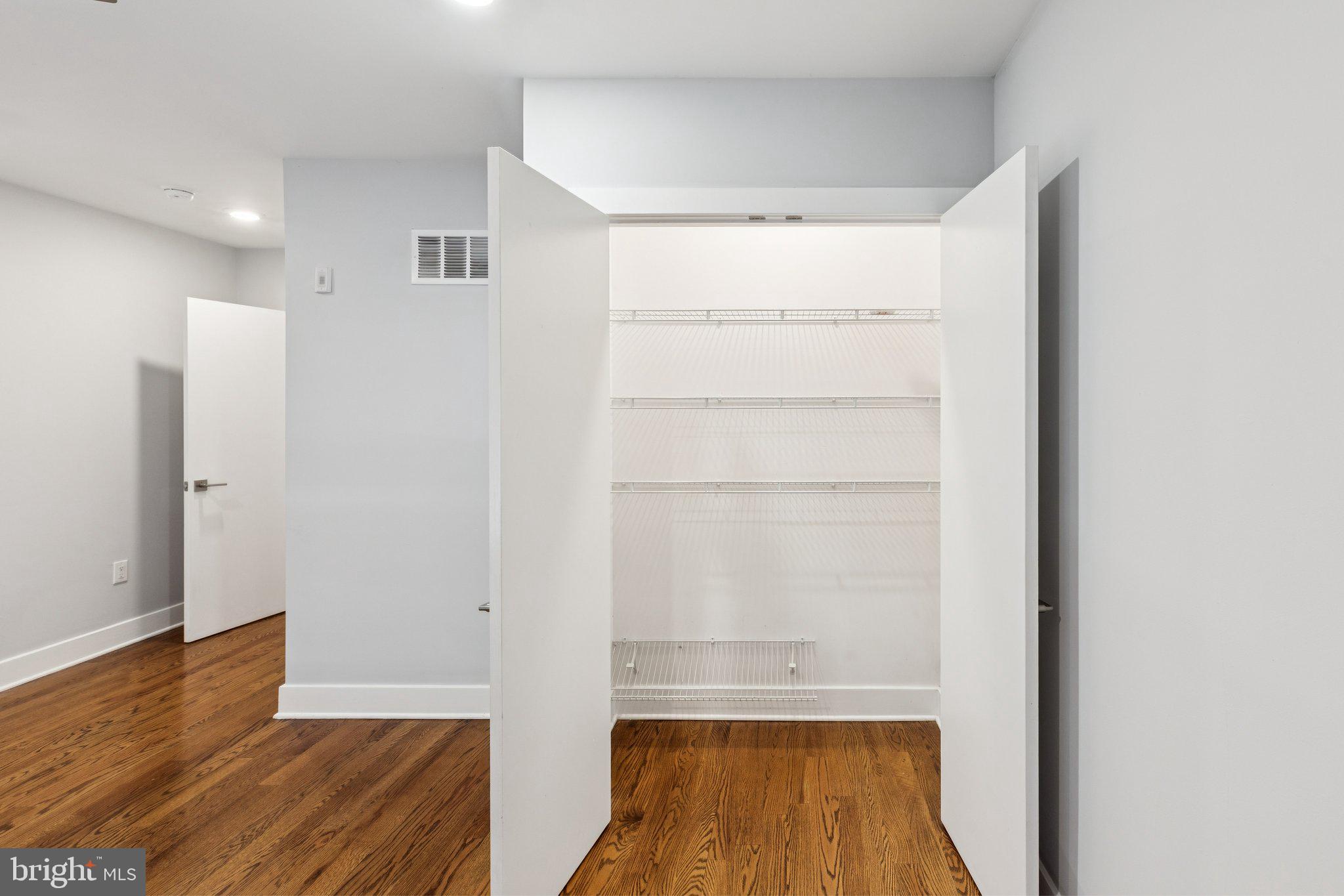 814 North Uber Street, Unit 2 Philadelphia, PA 19130 - Photo 59 of 68 a view of walk in closet with wooden floor