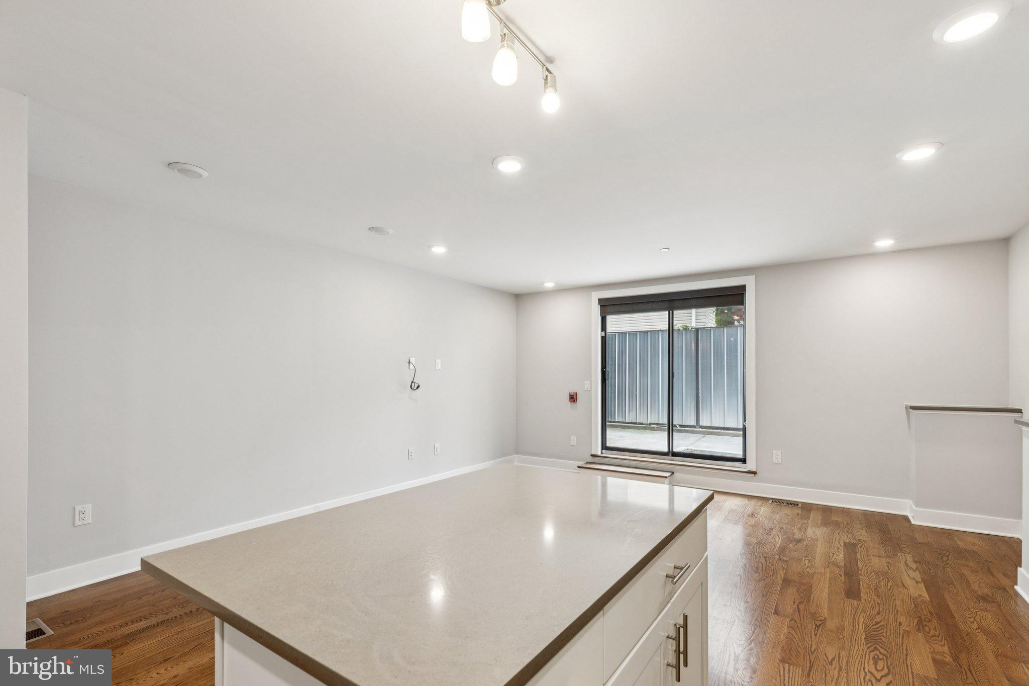 814 North Uber Street, Unit 2 Philadelphia, PA 19130 - Photo 62 of 68 a view of an empty room with wooden floor