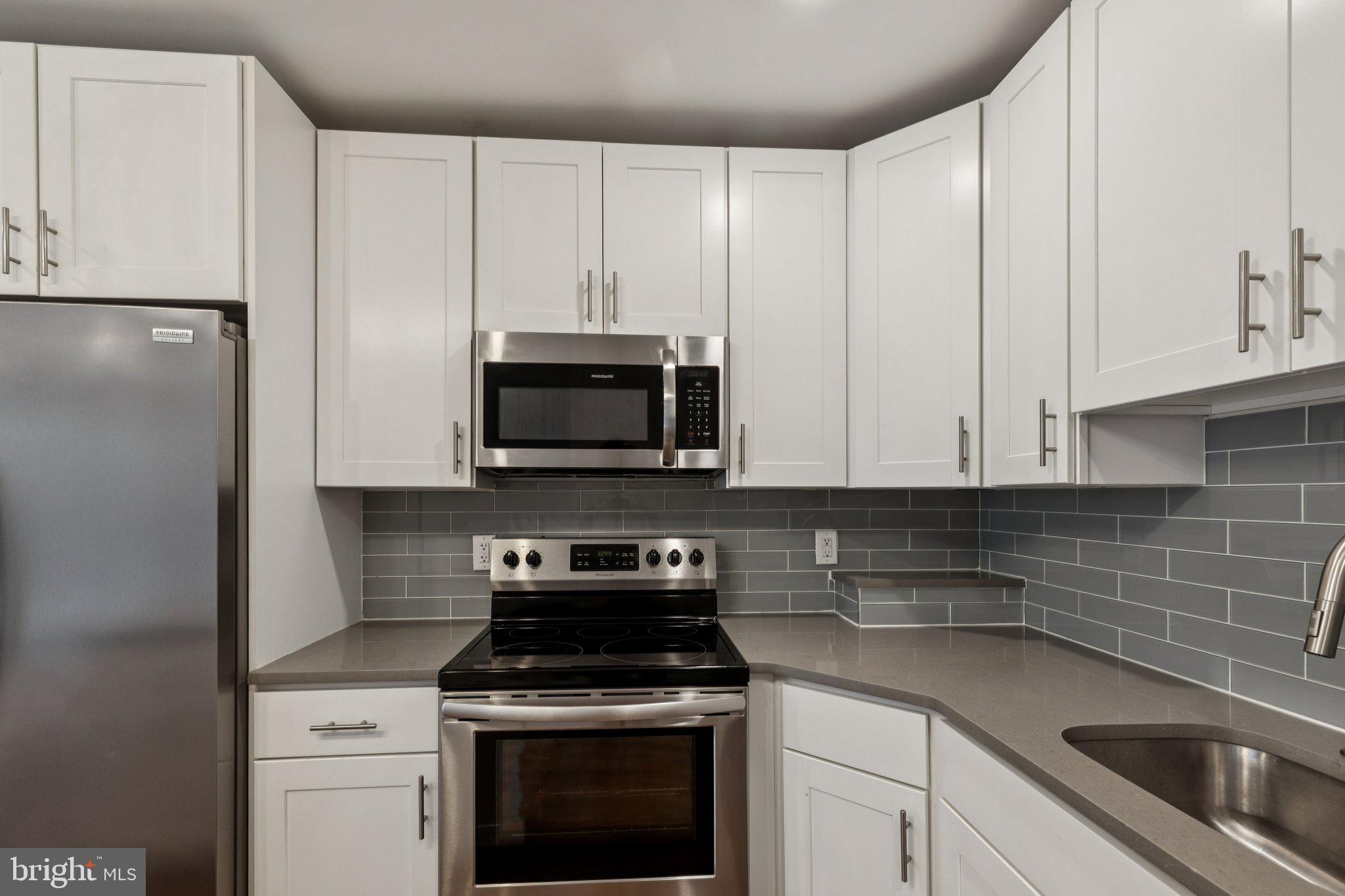 814 North Uber Street, Unit 2 Philadelphia, PA 19130 - Photo 10 of 68 a kitchen with appliances a sink and cabinets