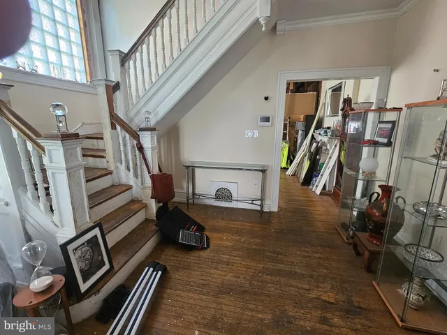 a view of an entryway with wooden floor