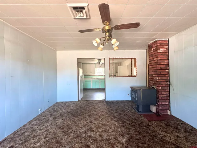 a view of a livingroom with furniture and chandelier