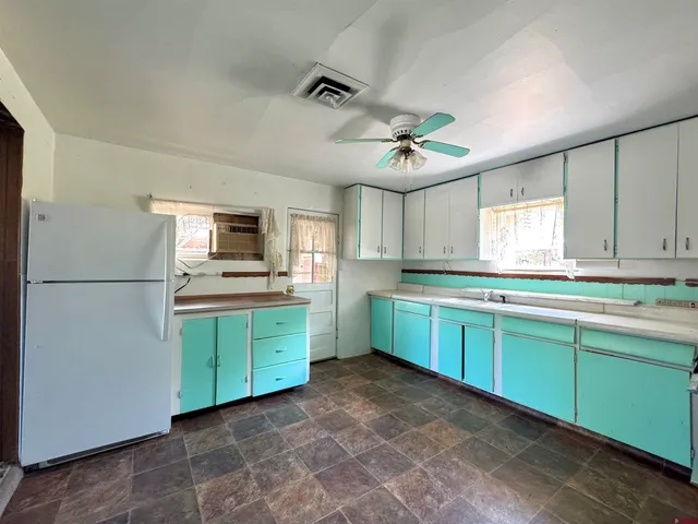 a view of an empty room with a fireplace