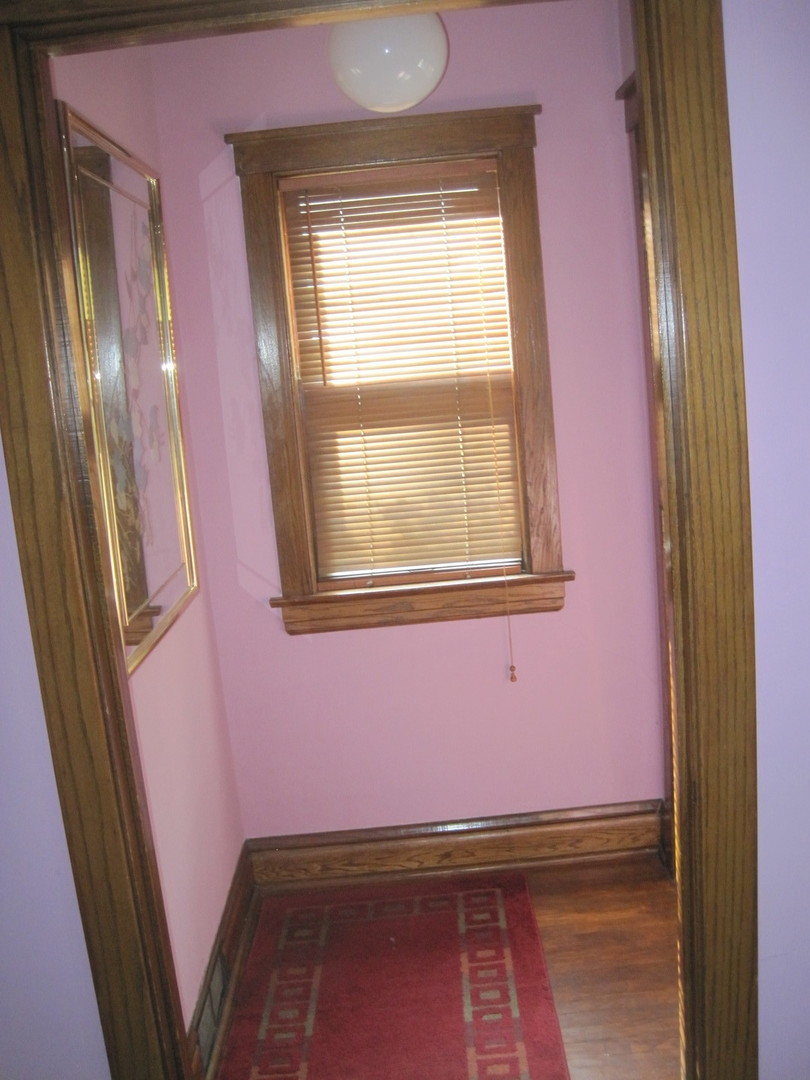 297 Olmsted Road Riverside, IL 60546 - Photo 2 of 15 a view of an empty room with a window