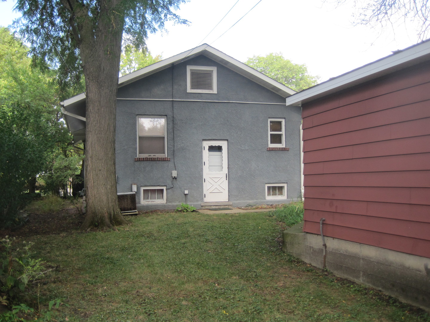 297 Olmsted Road Riverside, IL 60546 - Photo 15 of 15 a front view of a house with a yard and garage