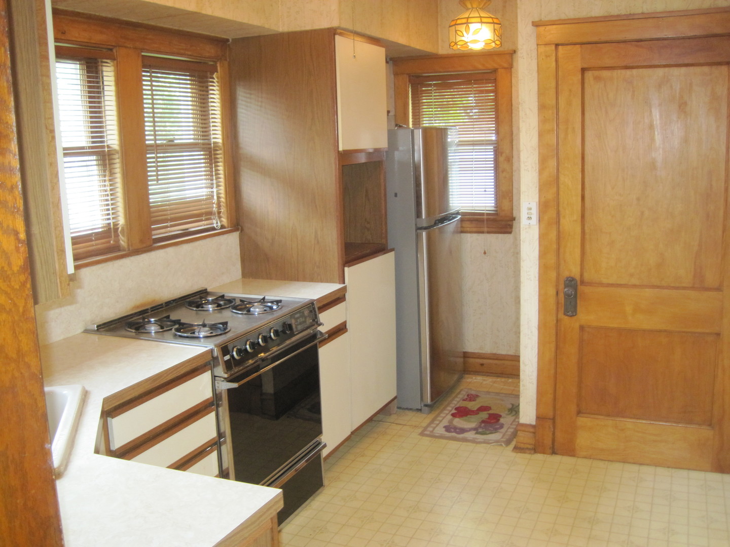 297 Olmsted Road Riverside, IL 60546 - Photo 9 of 15 a kitchen with stainless steel appliances granite countertop a refrigerator and a stove