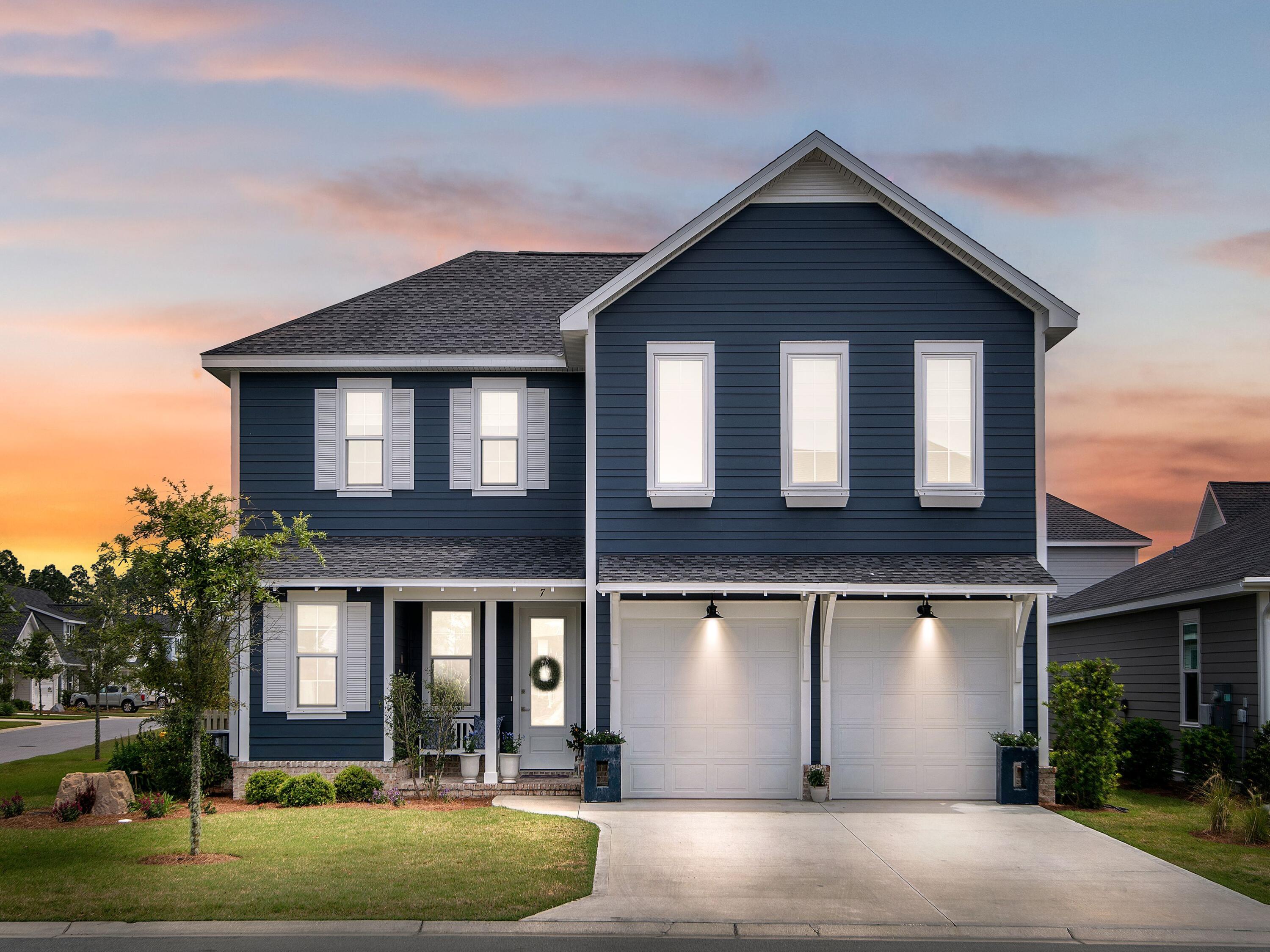7 Cambium Ct Inlet Beach Inlet Beach, FL 32461 - Photo 1 of 50 a front view of a house with garden