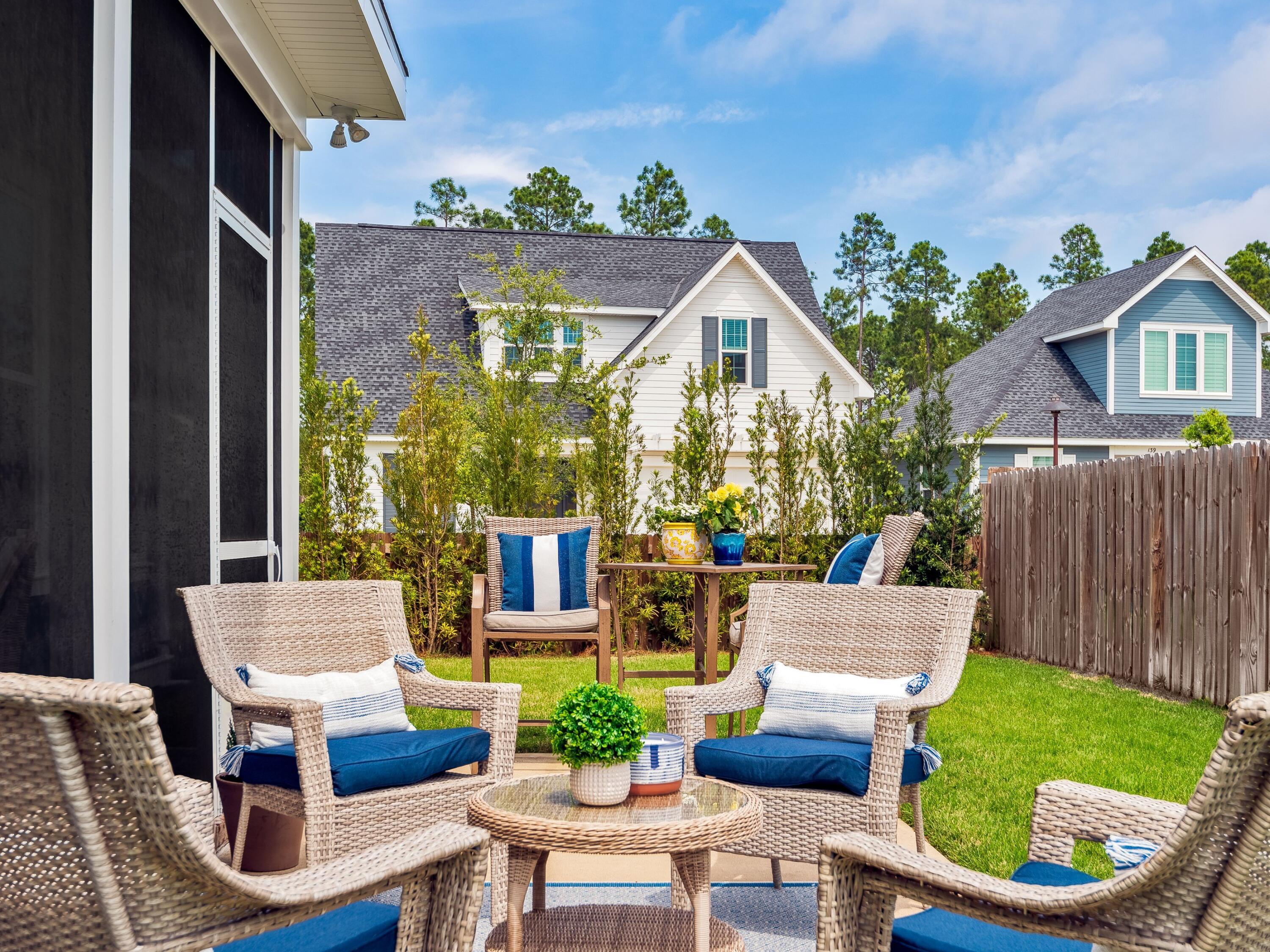 7 Cambium Ct Inlet Beach Inlet Beach, FL 32461 - Photo 14 of 50 a view of a patio with couches table and chairs and potted plants