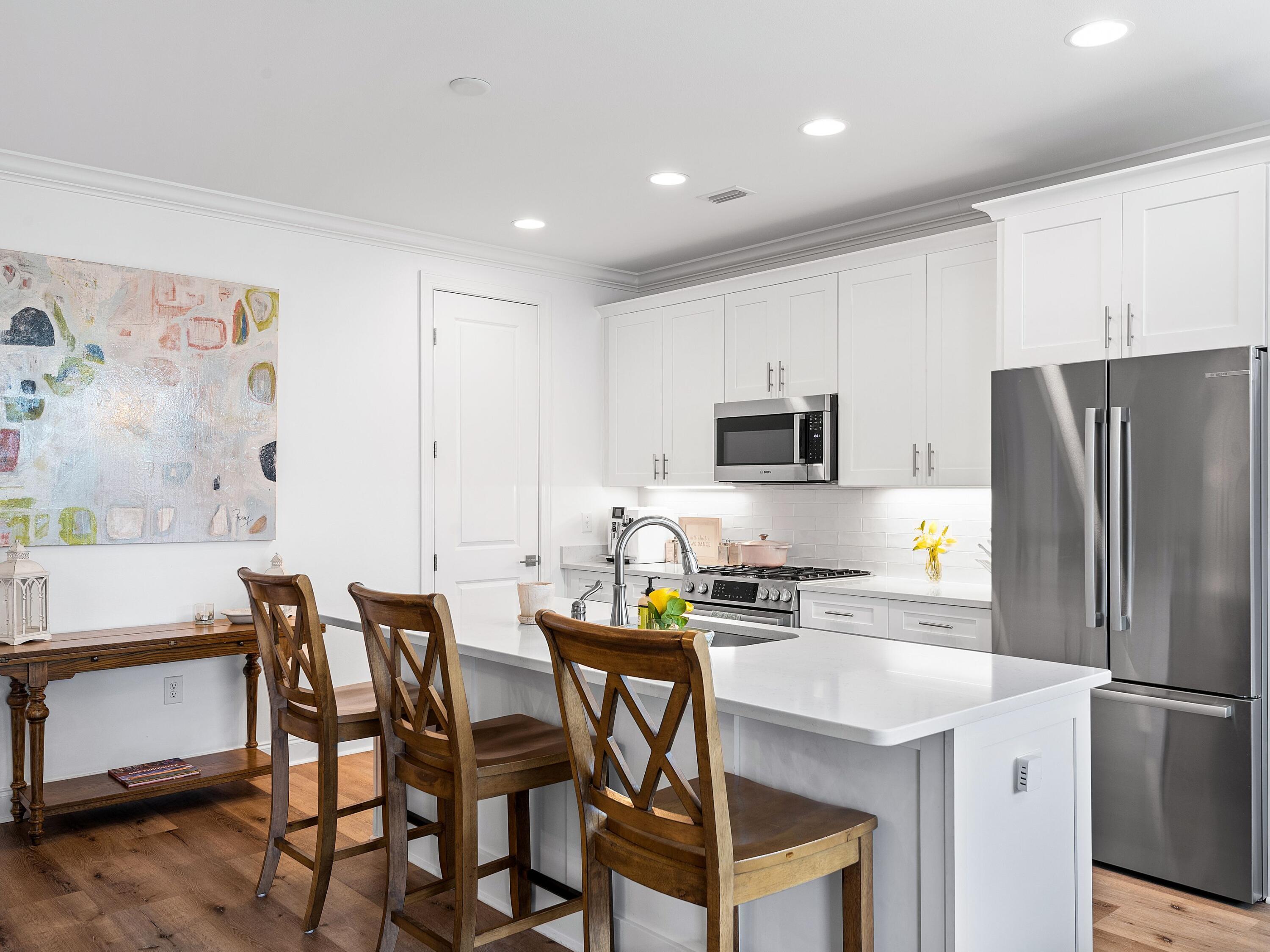 7 Cambium Ct Inlet Beach Inlet Beach, FL 32461 - Photo 19 of 50 a kitchen with a table chairs refrigerator and microwave
