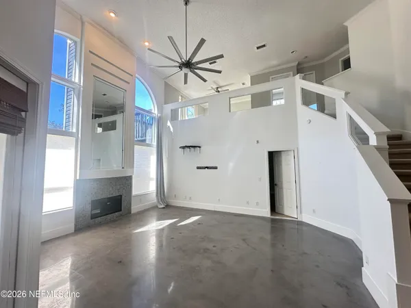 a kitchen with stainless steel appliances kitchen island granite countertop a sink stove and refrigerator