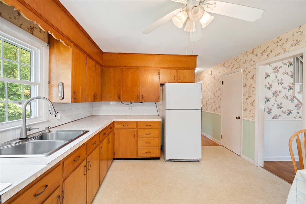 7 Stephen Drive Webster, MA 01570 - Photo 13 of 38 a kitchen with a sink a refrigerator and a sink