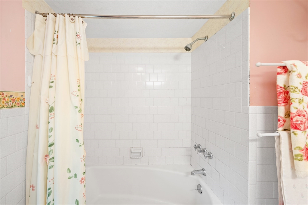 7 Stephen Drive Webster, MA 01570 - Photo 23 of 38 a bathroom with a shower curtain and a shower curtain