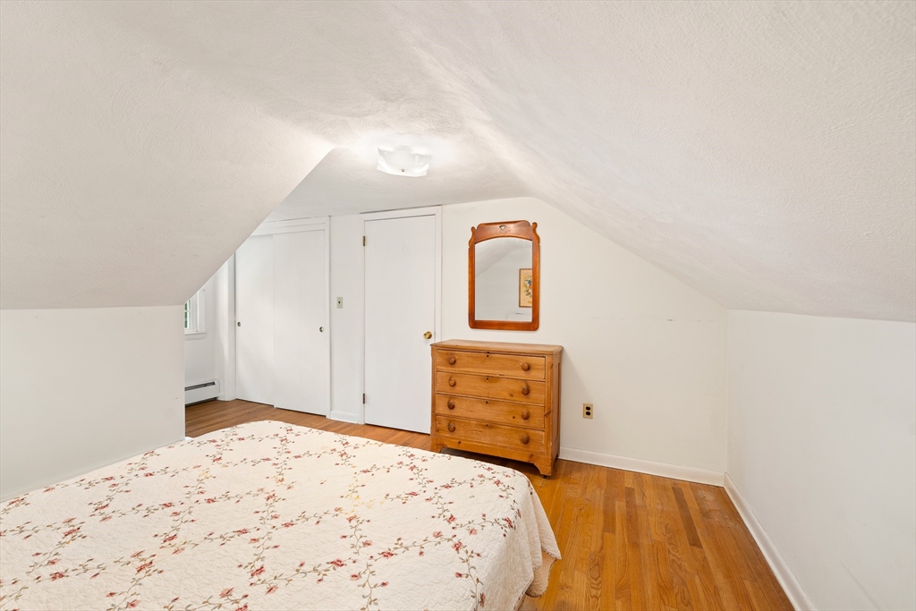 7 Stephen Drive Webster, MA 01570 - Photo 25 of 38 a bedroom with a bed and a dresser