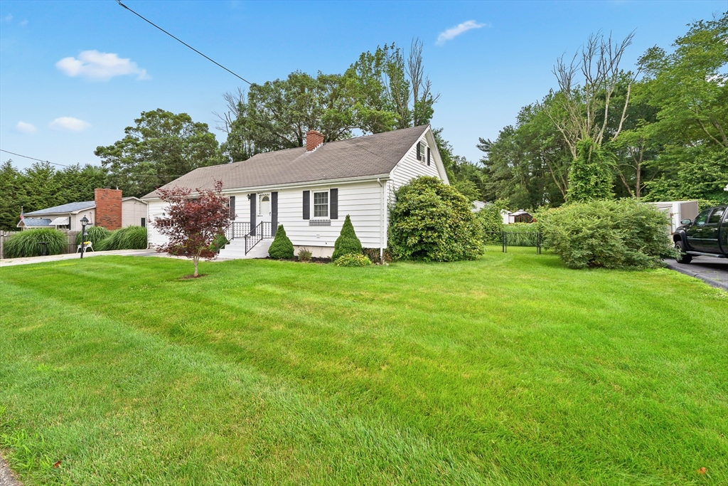 7 Stephen Drive Webster, MA 01570 - Photo 33 of 38 a front view of house with yard and green space