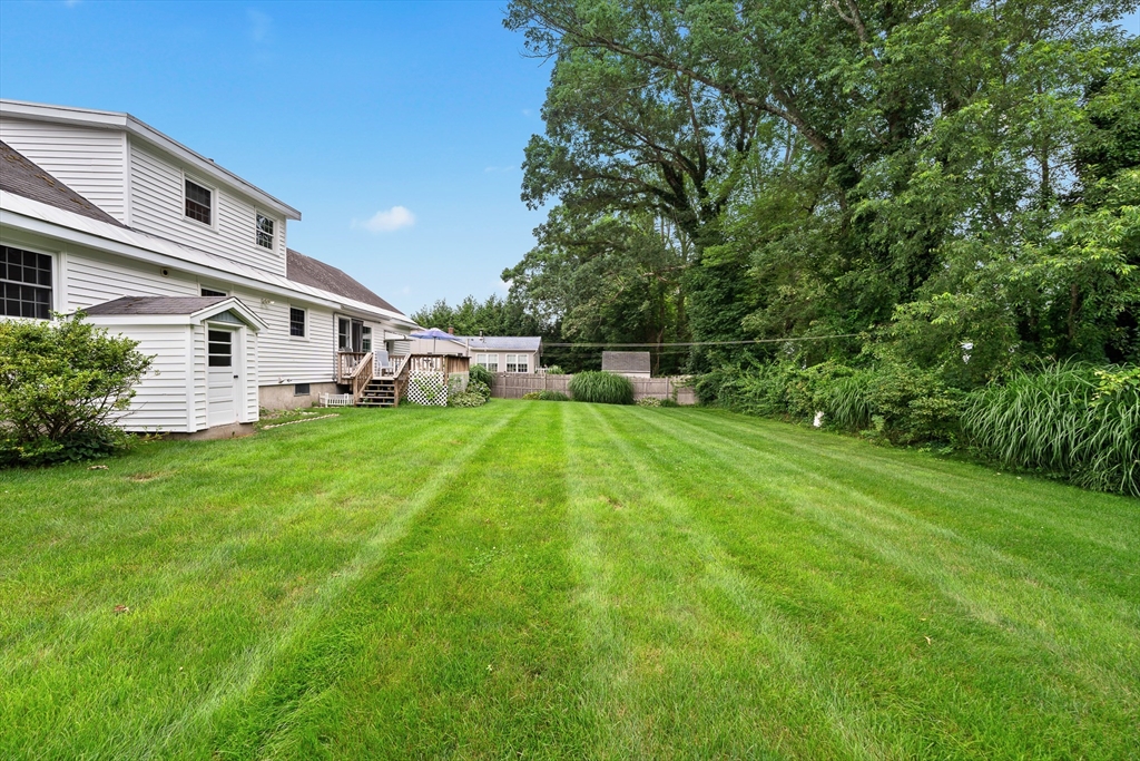 7 Stephen Drive Webster, MA 01570 - Photo 34 of 38 a view of a white house with a yard and sitting area
