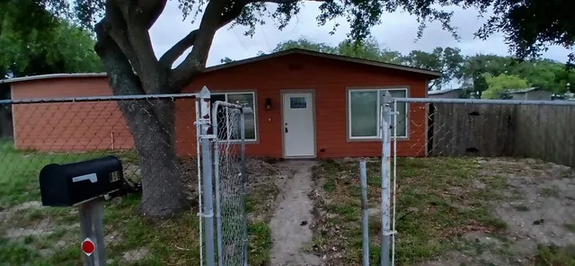 a backyard of a house with lots of green space
