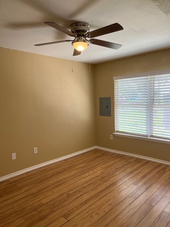 450 Skipper Lane Corpus Christi, TX 78418 - Photo 14 of 26 a view of a room with wooden floor and a window