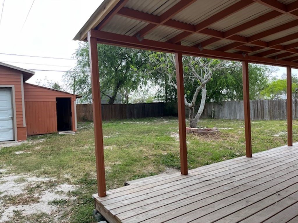 450 Skipper Lane Corpus Christi, TX 78418 - Photo 6 of 26 a view of a backyard with wooden floor and roof