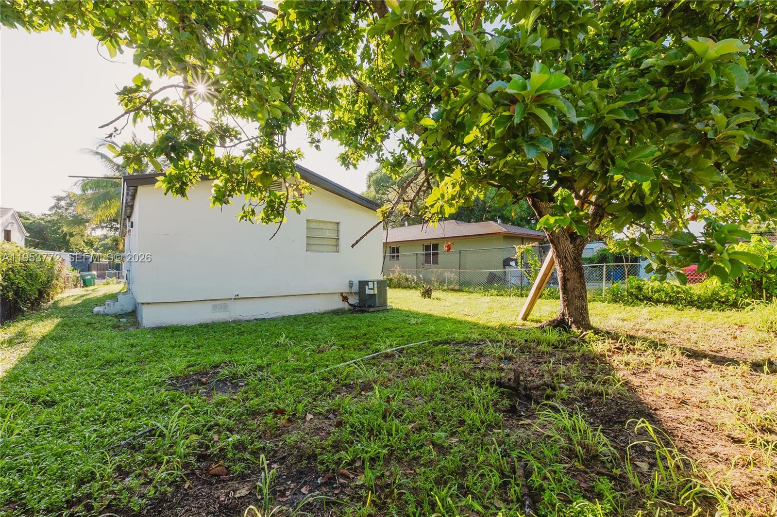4338 Northwest 24th Avenue Miami, FL 33142 - Photo 26 of 26 a view of a house with backyard and sitting area