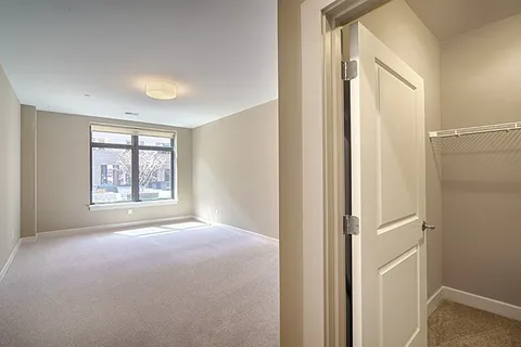 a view of an empty room with a window