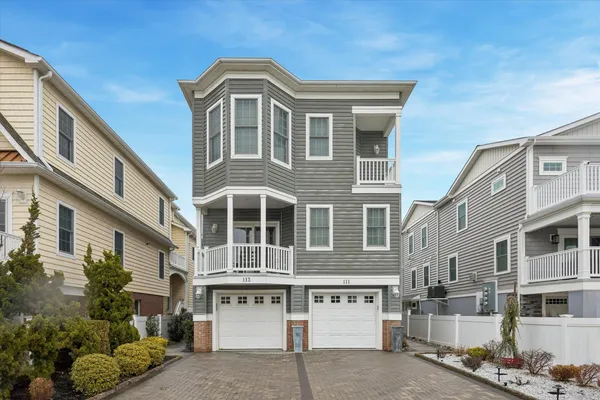 a front view of a residential apartment building with a yard