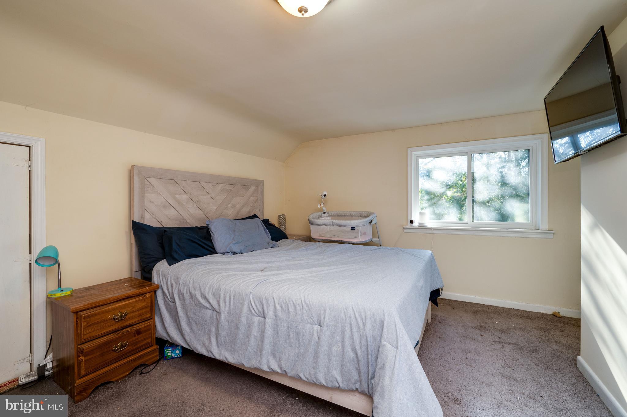 175 Forgedale Road Fleetwood, PA 19522 - Photo 20 of 42 a bedroom with a bed a flat screen tv and windows