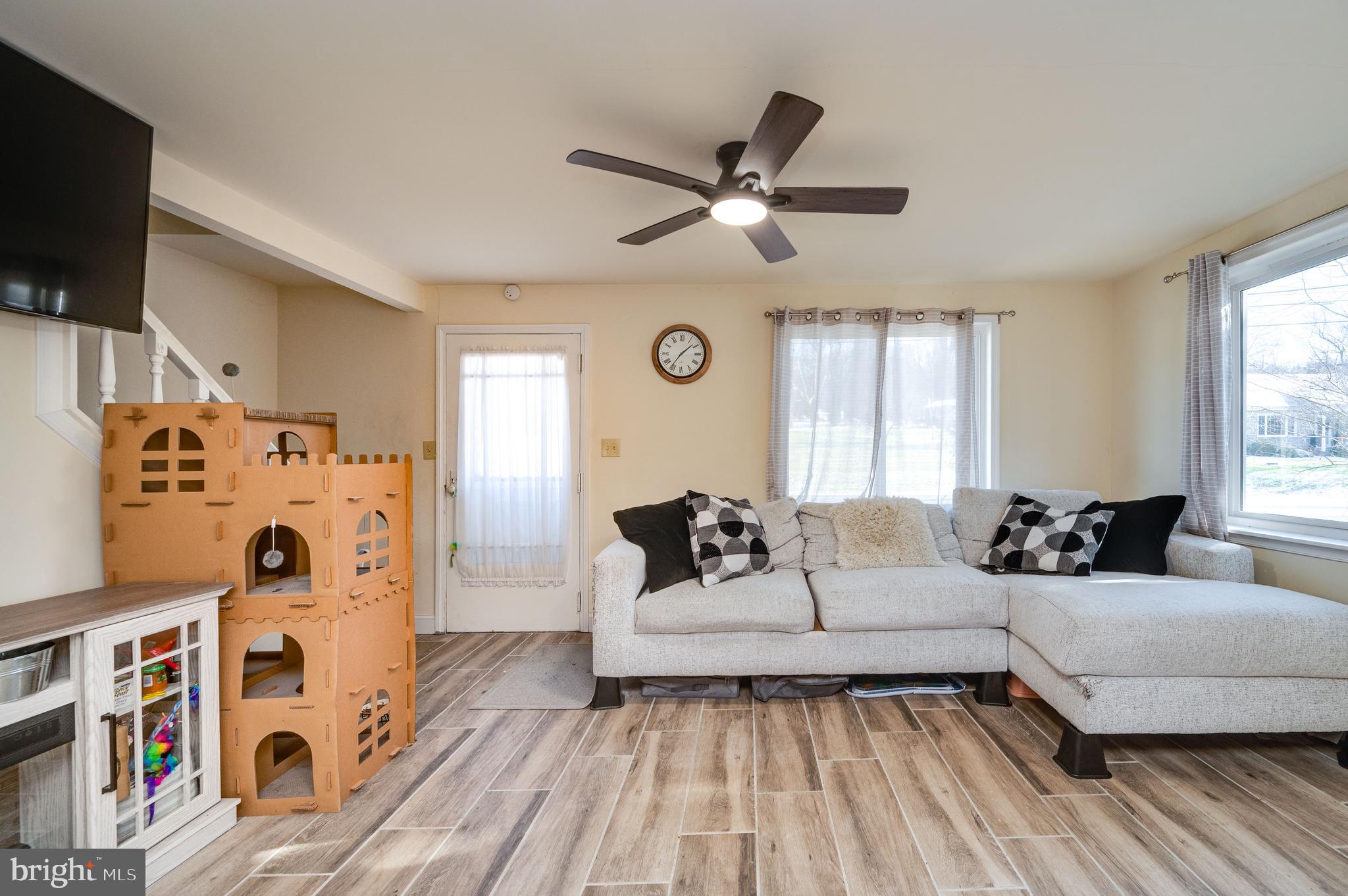 175 Forgedale Road Fleetwood, PA 19522 - Photo 4 of 42 a living room with furniture and a flat screen tv