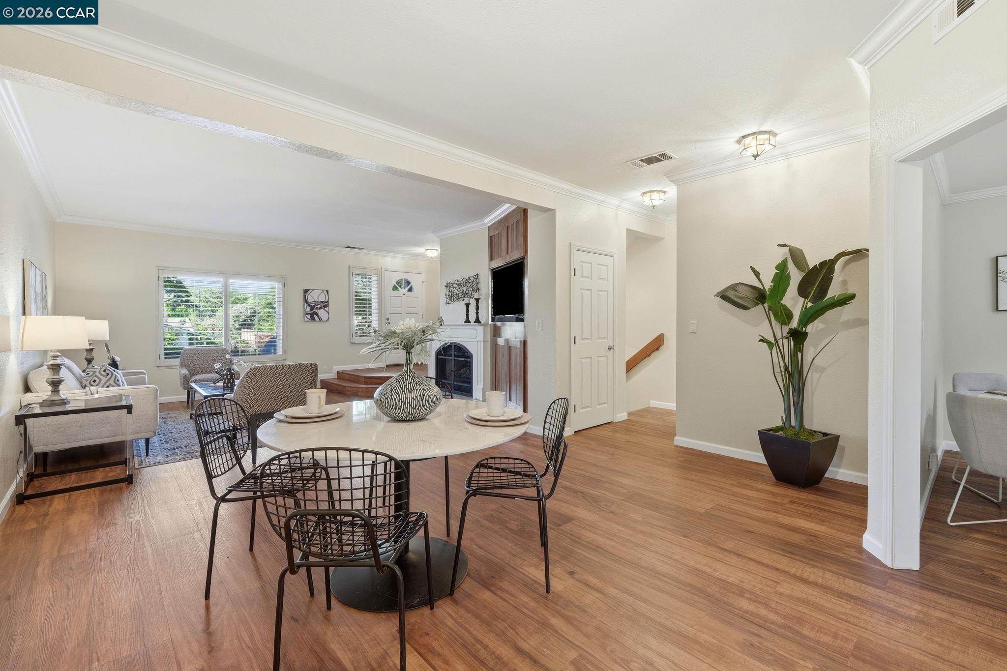 1707 Geary Road Walnut Creek, CA 94597 - Photo 15 of 43 a view of a dining room with furniture and wooden floor
