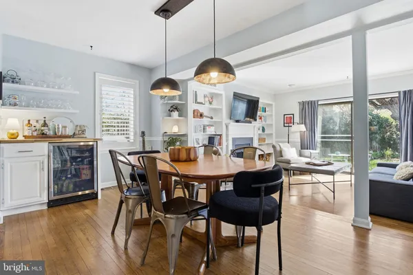 a view of a dining room with furniture window and wooden floor