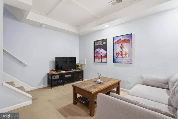 a living room with furniture and a table