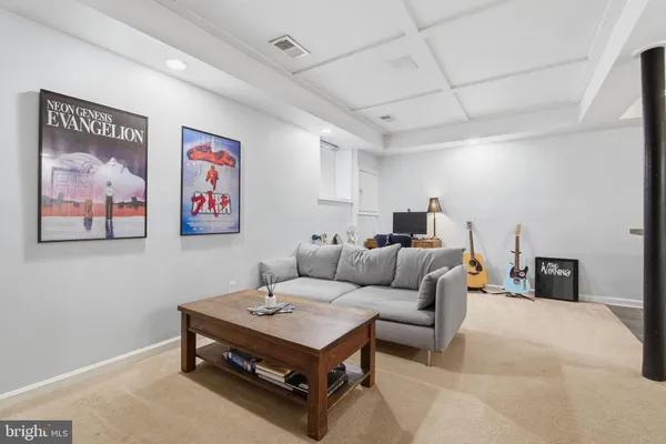 a living room with furniture and a table