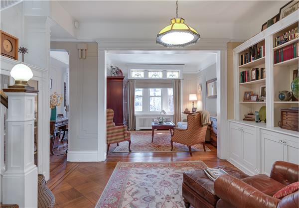 42 Fuller Place Brooklyn, NY 11215 - Photo 1 of 1 a living room with furniture and a chandelier