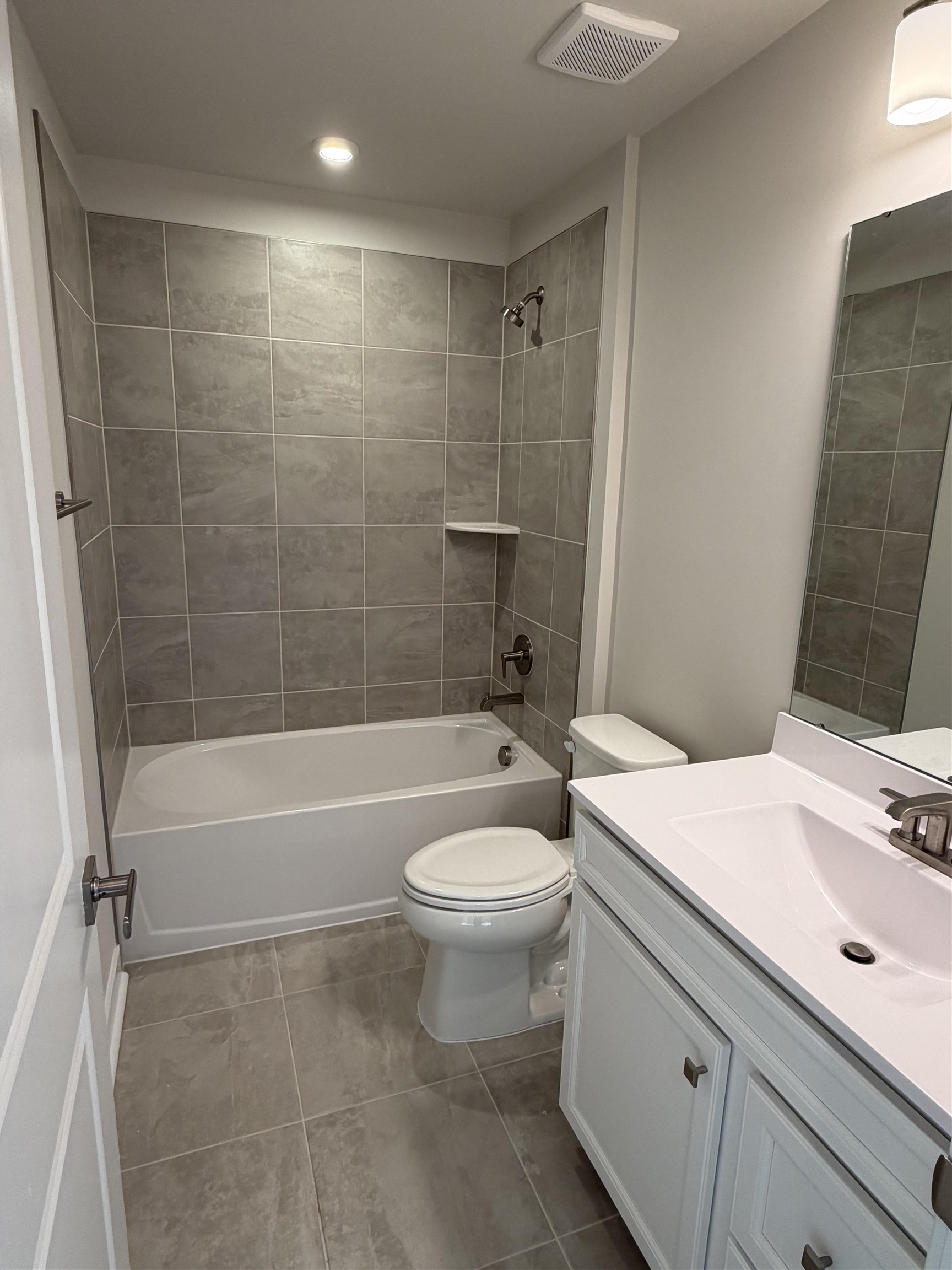 1303 Pleasant View Drive, Unit B North Myrtle Beach, SC 29582 - Photo 10 of 13 Bathroom featuring vanity, shower / bathtub combination, and light tile patterned floors