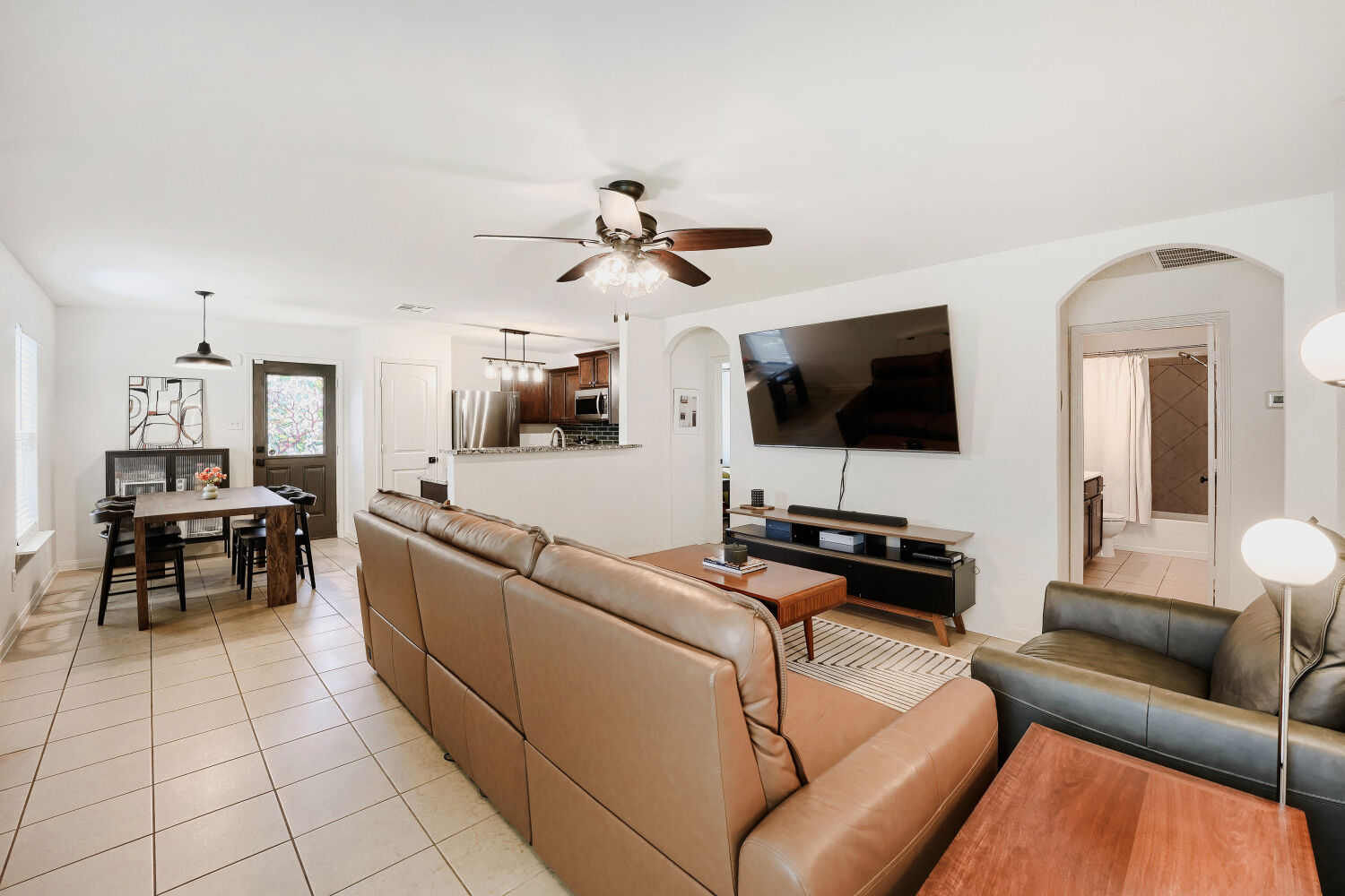 116 Millers Loop Jarrell, TX 76537 - Photo 23 of 23 An inviting open floorplan seamlessly connects the living area to the kitchen and dining space.