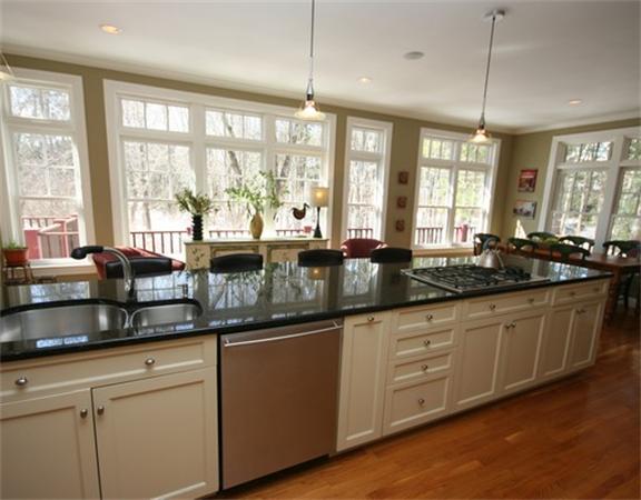 5 Granville Road Lincoln, MA 01773 - Photo 12 of 30 a kitchen with granite countertop a large window sink and cabinets