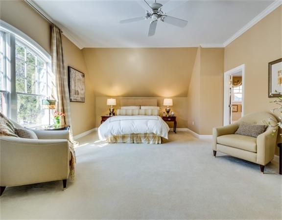 5 Granville Road Lincoln, MA 01773 - Photo 20 of 30 a bedroom with a bed and a couch