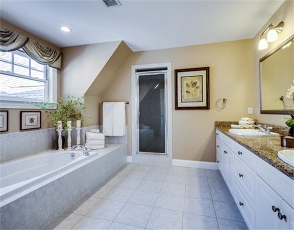 5 Granville Road Lincoln, MA 01773 - Photo 22 of 30 a large bathroom with a sink mirror and a bath tub
