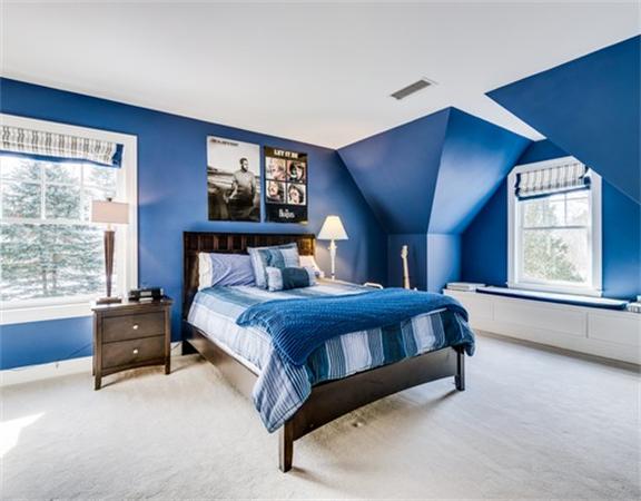 5 Granville Road Lincoln, MA 01773 - Photo 24 of 30 a bed sitting in a bedroom next to a window