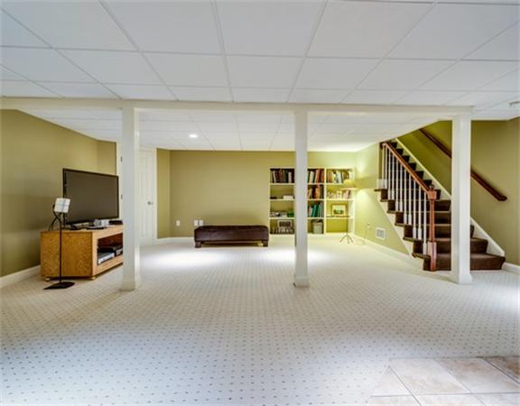 5 Granville Road Lincoln, MA 01773 - Photo 27 of 30 a view of a livingroom with furniture and a flat screen tv